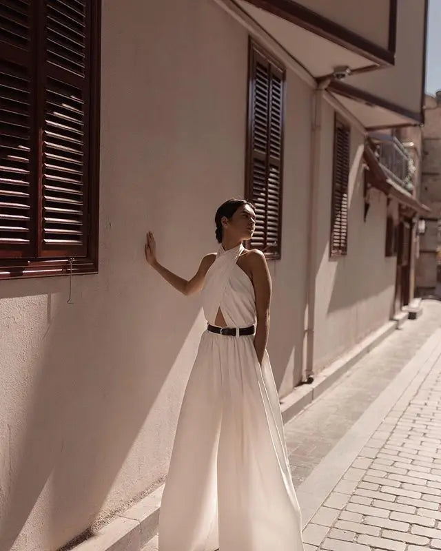 2019 New Women Jumpsuits Sexy Backless Hollow Out White Rompers Female Solid Wide Leg Loose Ruffled Jumpsuits
