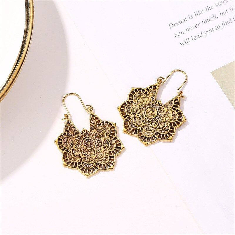 National wind earrings exquisite retro metal hollow flower earrings bohemian carved aristocratic wind earrings ladies jewelry