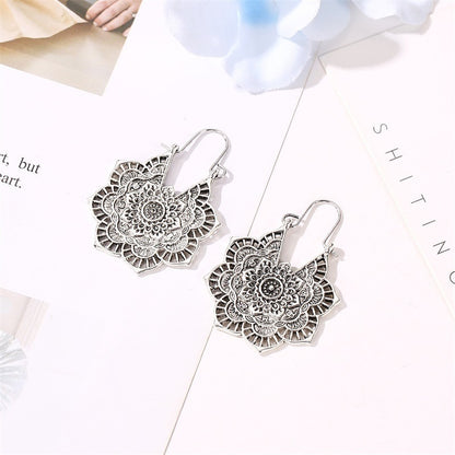 National wind earrings exquisite retro metal hollow flower earrings bohemian carved aristocratic wind earrings ladies jewelry